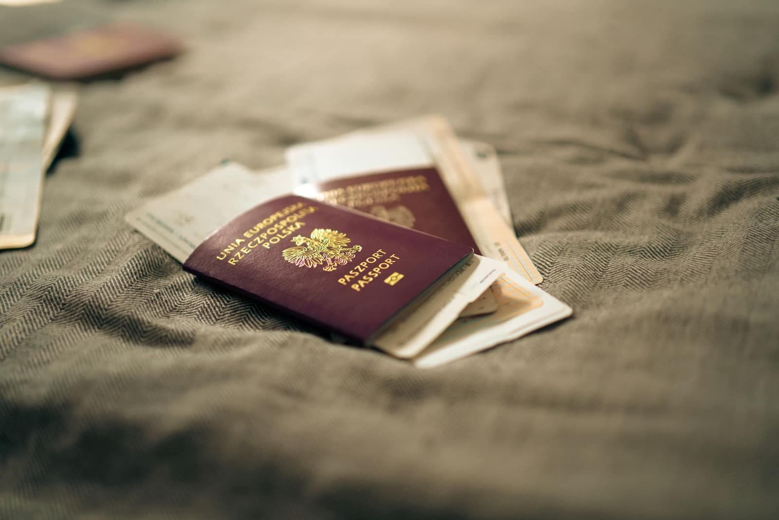 Passports and plane tickets lying on a fabric