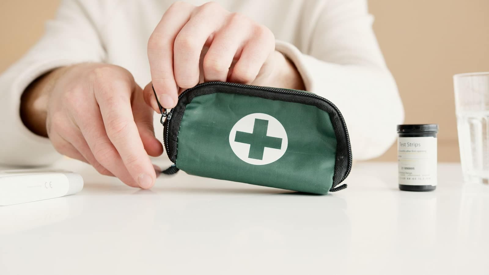 Opening a first aid pouch before the trip
