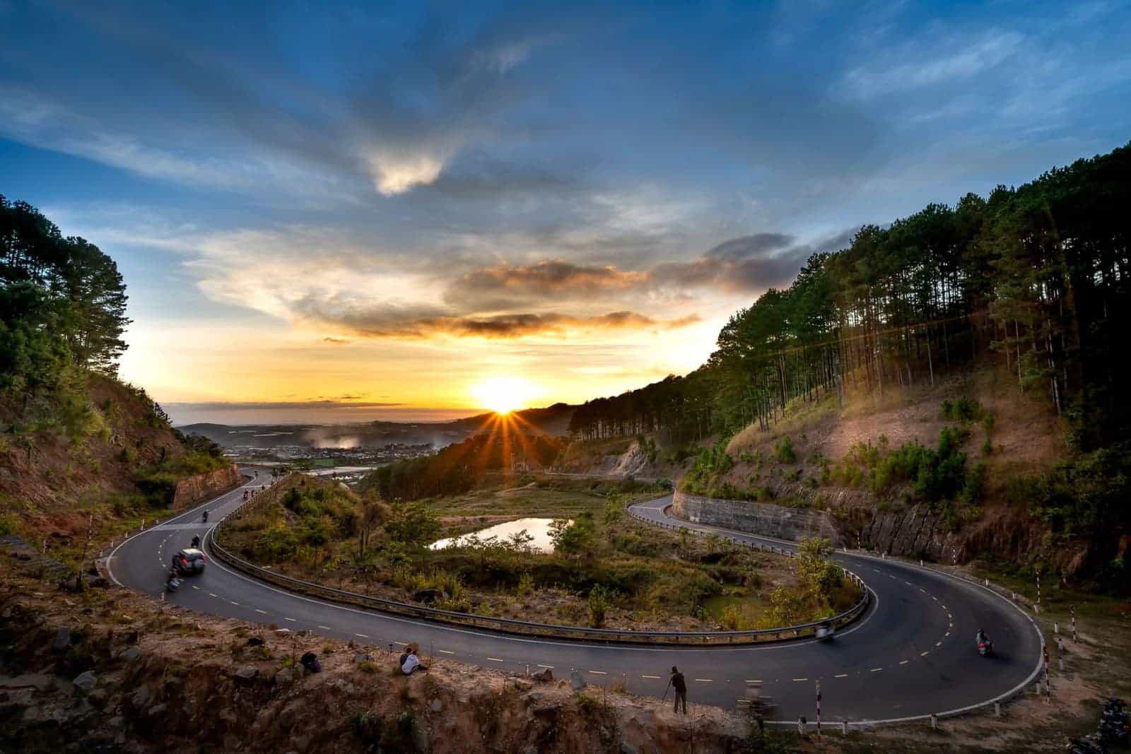 Winding mountain road at sunset