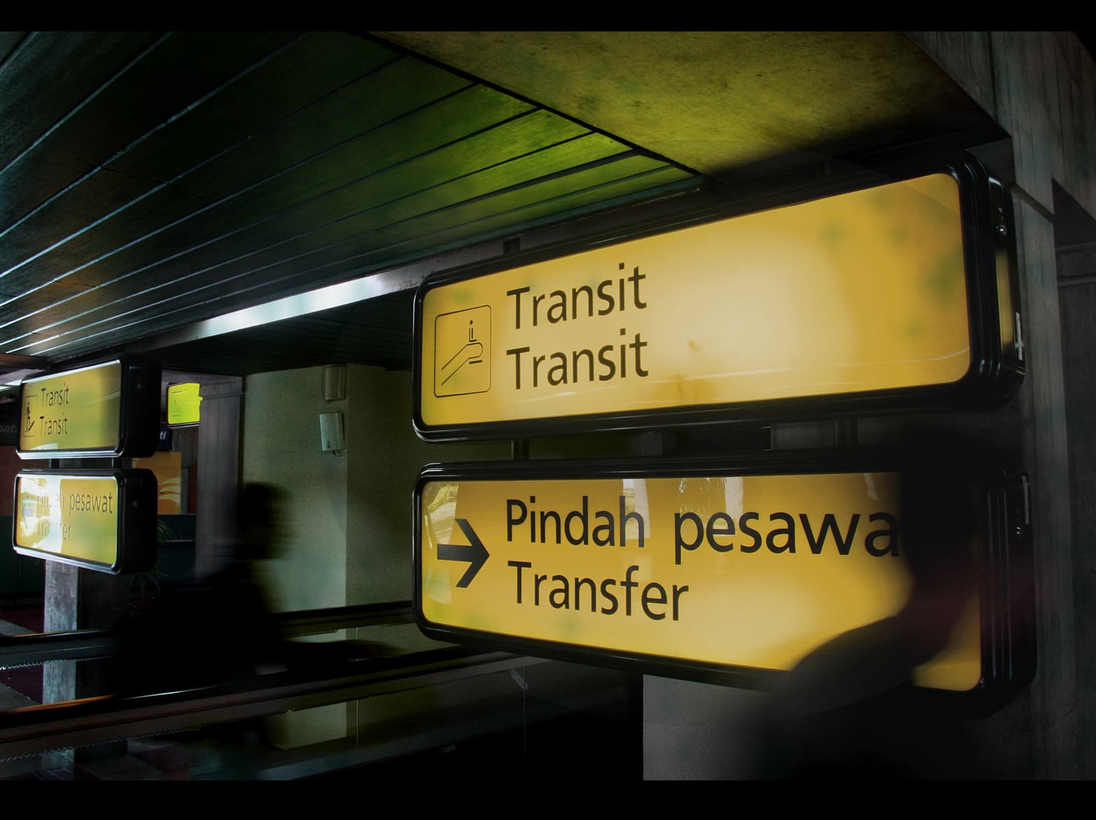 Transit signs in an airport terminal